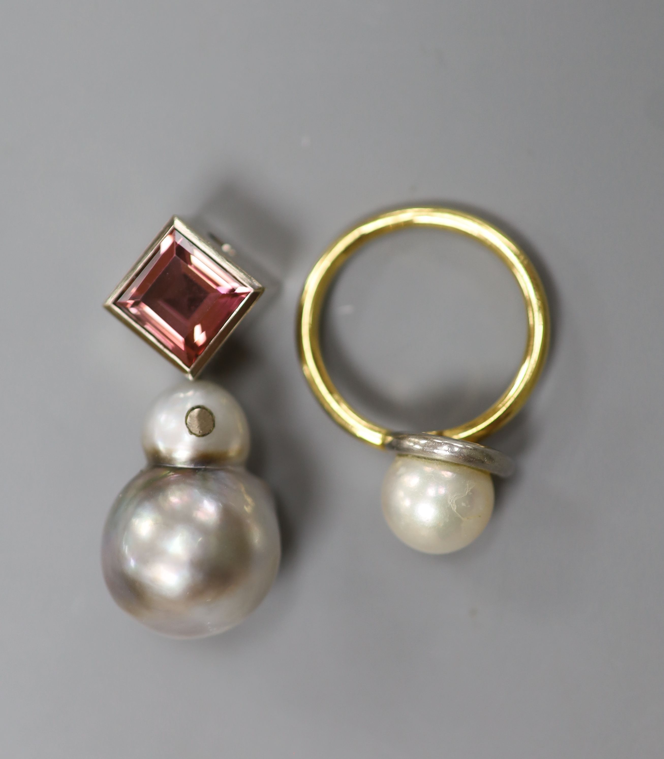 A modern 585 white metal, baroque pearl and pink tourmaline set pendant and a yellow metal cultured pearl and diamond chip set ring